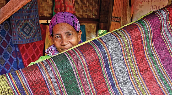 "Yakan weaver in Weaving Village in Zamboanga, Philippines" Yakan Weaving Village